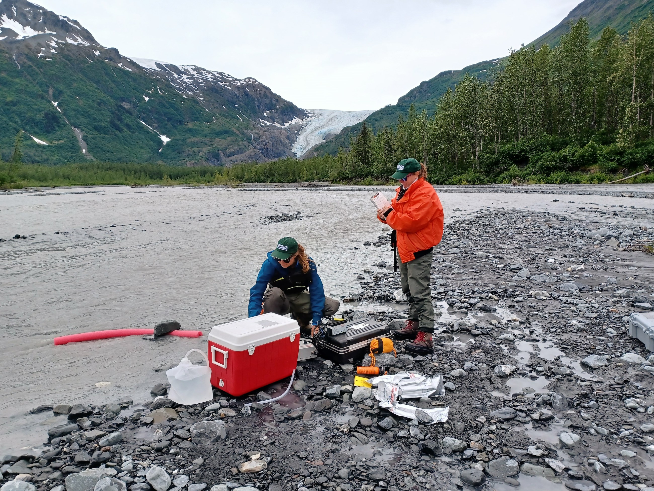 USGS scientists collect surface-water samples for antimicrobial-resistance research at Exit Creek in Kenai Fjords National Park, Alaska, on 18 July 2023.